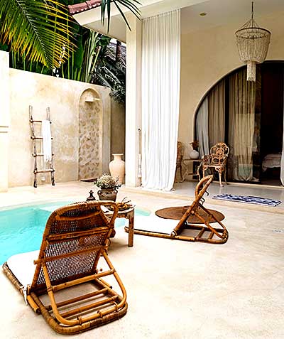 image of low cane chairs beside a pool
